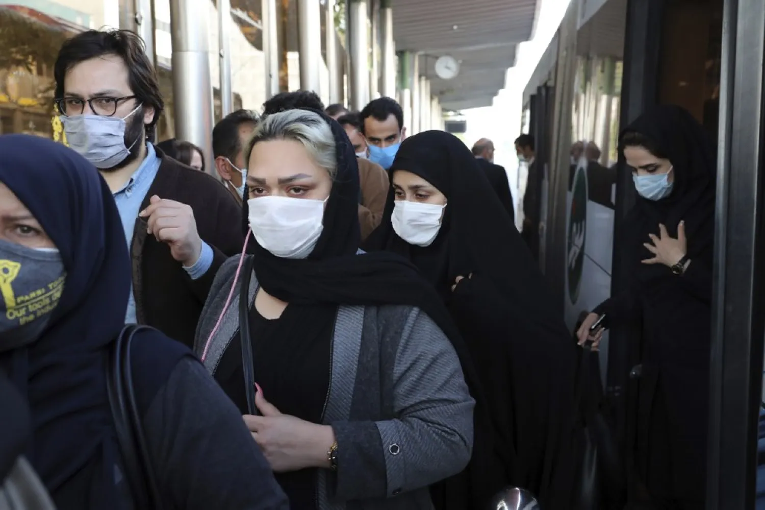 FILE - In this Oct. 11, 2020, file photo, people wear protective face masks to help prevent the spread of the coronavirus in downtown Tehran, Iran.  (AP Photo/Ebrahim Noroozi, File)
