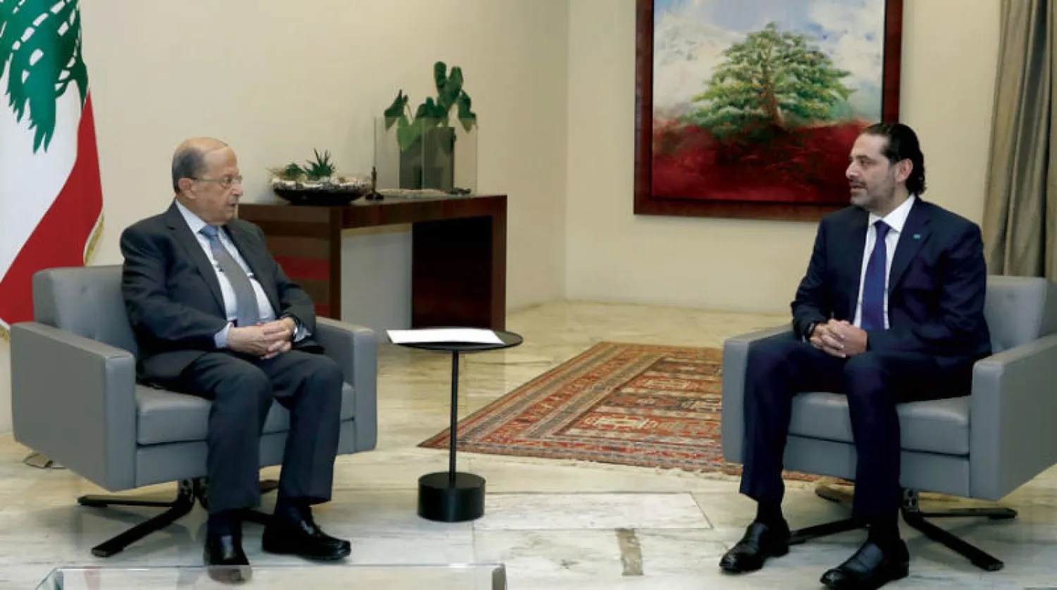 الرئيسان عون والحريري وعقبات تشكيل الحكومة (أ.ف.ب)