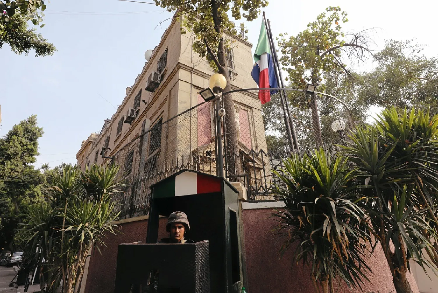 A member of the security forces is seen outside the Italian Embassy in Cairo, Egypt. (Reuters)