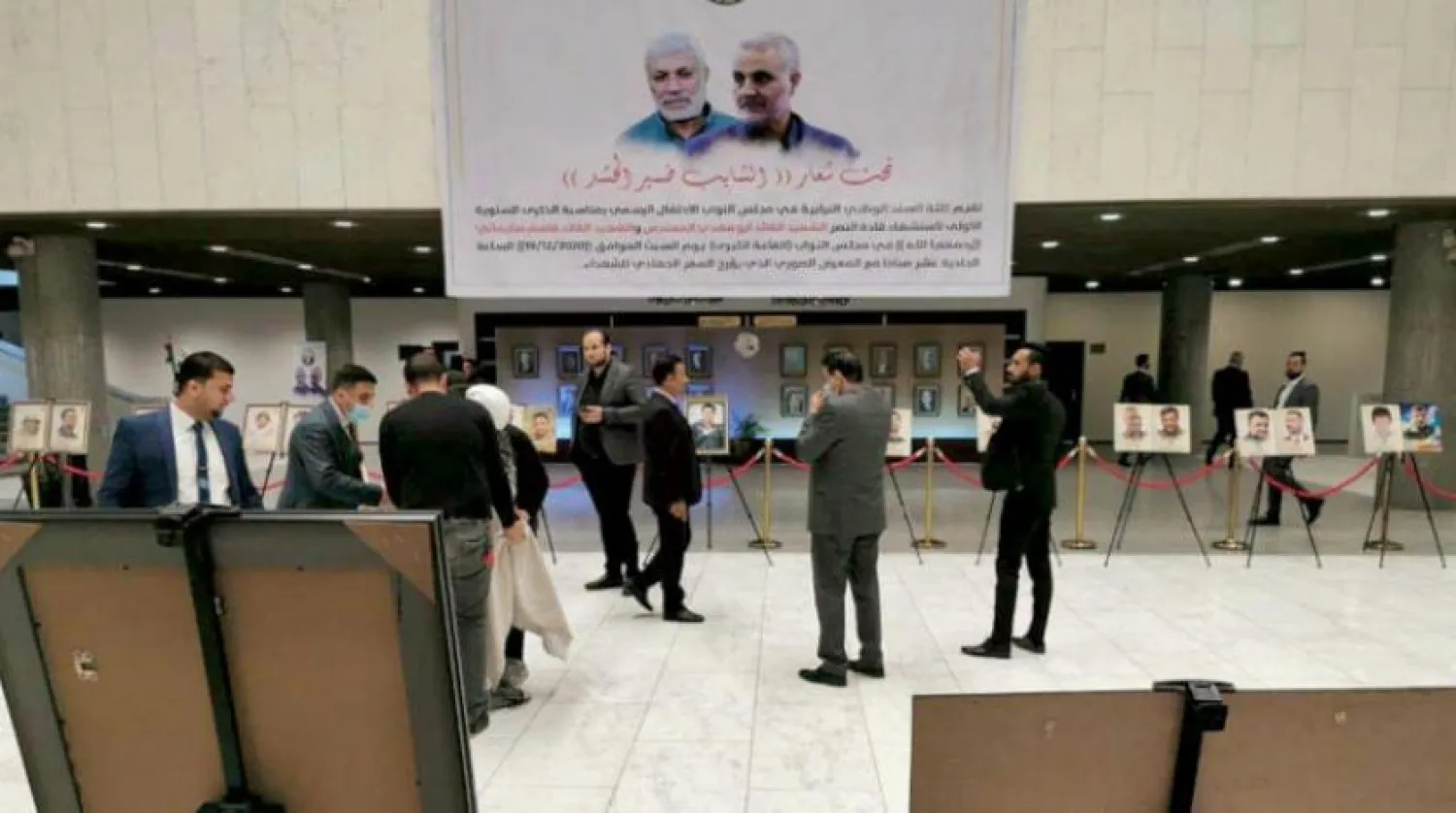A photo exhibition hoisted at the Iraqi parliament to commemorate Iran's slain commander Qassem Soleimani and Popular Mobilization Forces (PMF) leader Abu Mahdi al-Muhandis, PMF media outlets 