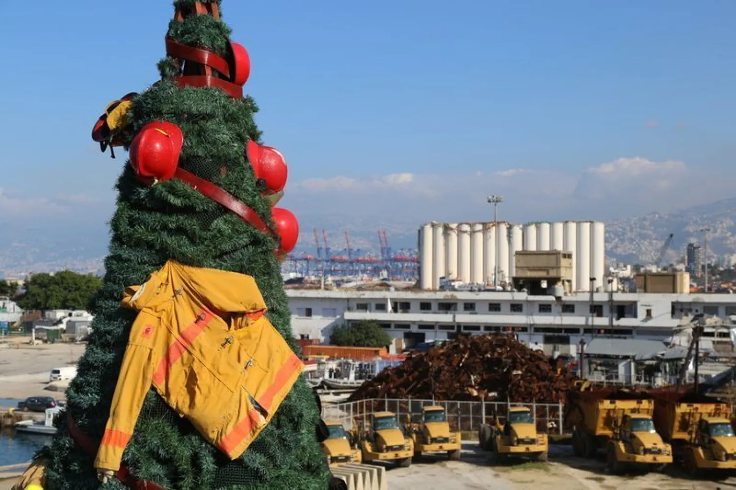 A Christmas tree made by Lebanese artist Hayat Nazer and decorated with uniforms of firefighters and rescuers as a way to pay tribute to those who died at Beirut port explosion, is seen in Beirut | REUTERS