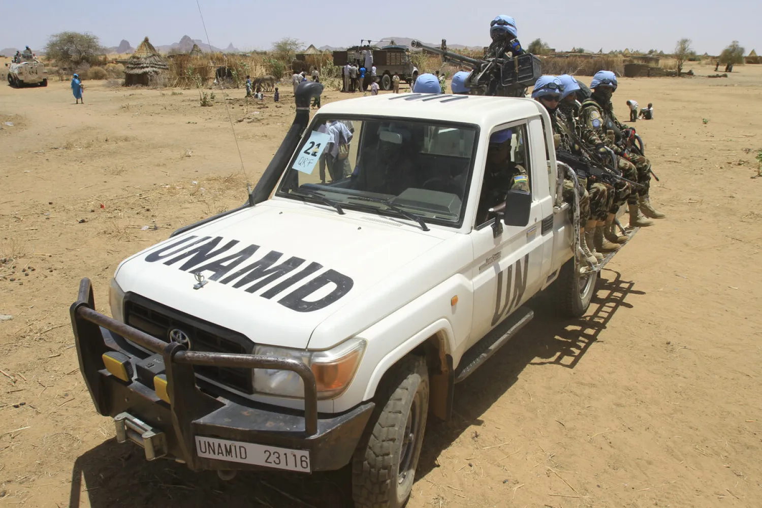 Peacekeepers with the United Nations-African Union Mission in Darfur (UNAMID) patrol the Shangil Tobaya area for displaced people in North Darfur state, on June 18, 2013. ASHRAF SHAZLY/AFP 