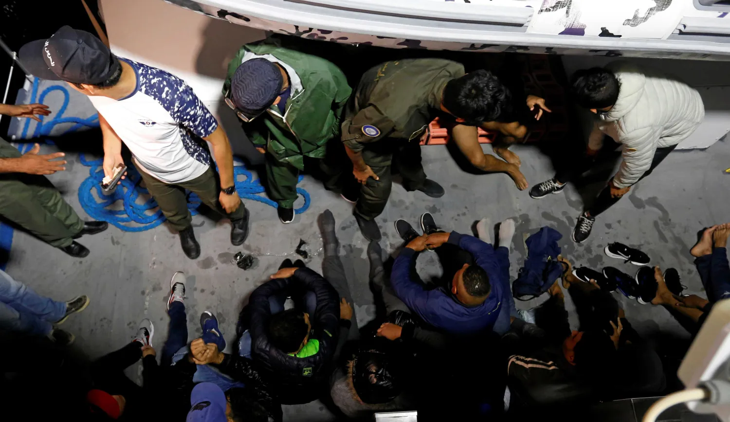 FILE - Migrants are seen on a boat after being rescued by Tunisian coast guard, off the coast of Bizerte, Tunisia, Oct. 12, 2017. Reuters
