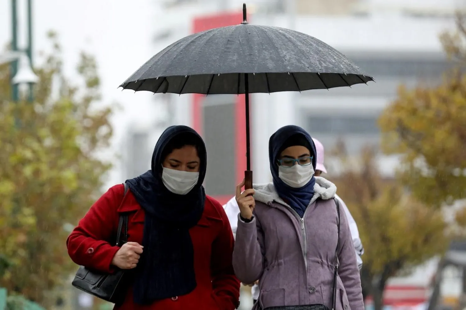 People walk on a street after Tehran reopened following a two-week shutdown, amid the coronavirus disease (COVID-19) outbreak, Iran December 6, 2020. (Reuters)