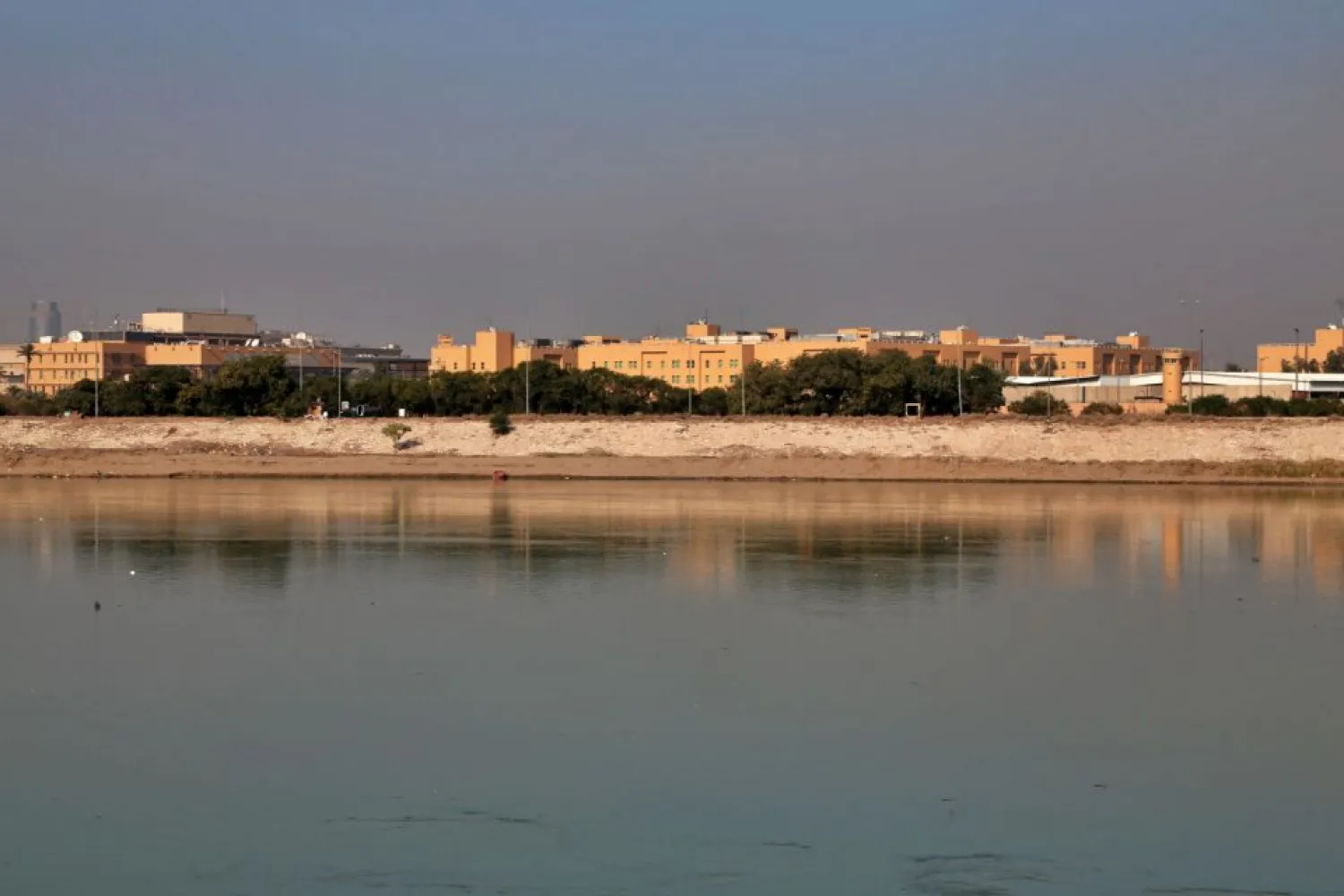 FILE - In this Jan. 3, 2020 file photo, the US Embassy is seen from across the Tigris River in Baghdad, Iraq. (AP Photo/Khalid Mohammed, File)