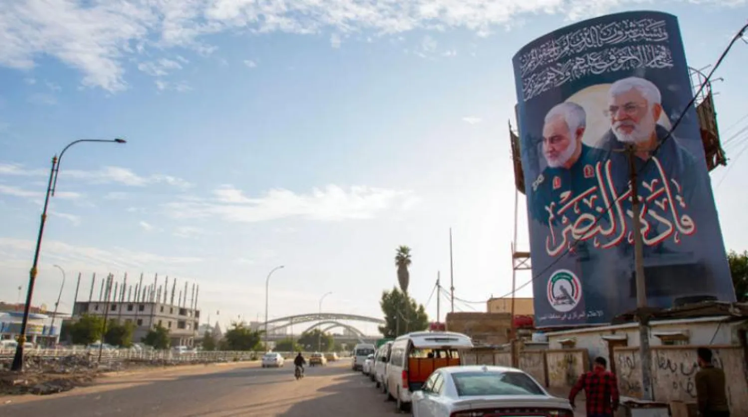 Kasım Süleymani ve Ebu Mehdi el-Muhandis'in Basra'daki fotoğrafları.  (AFP)