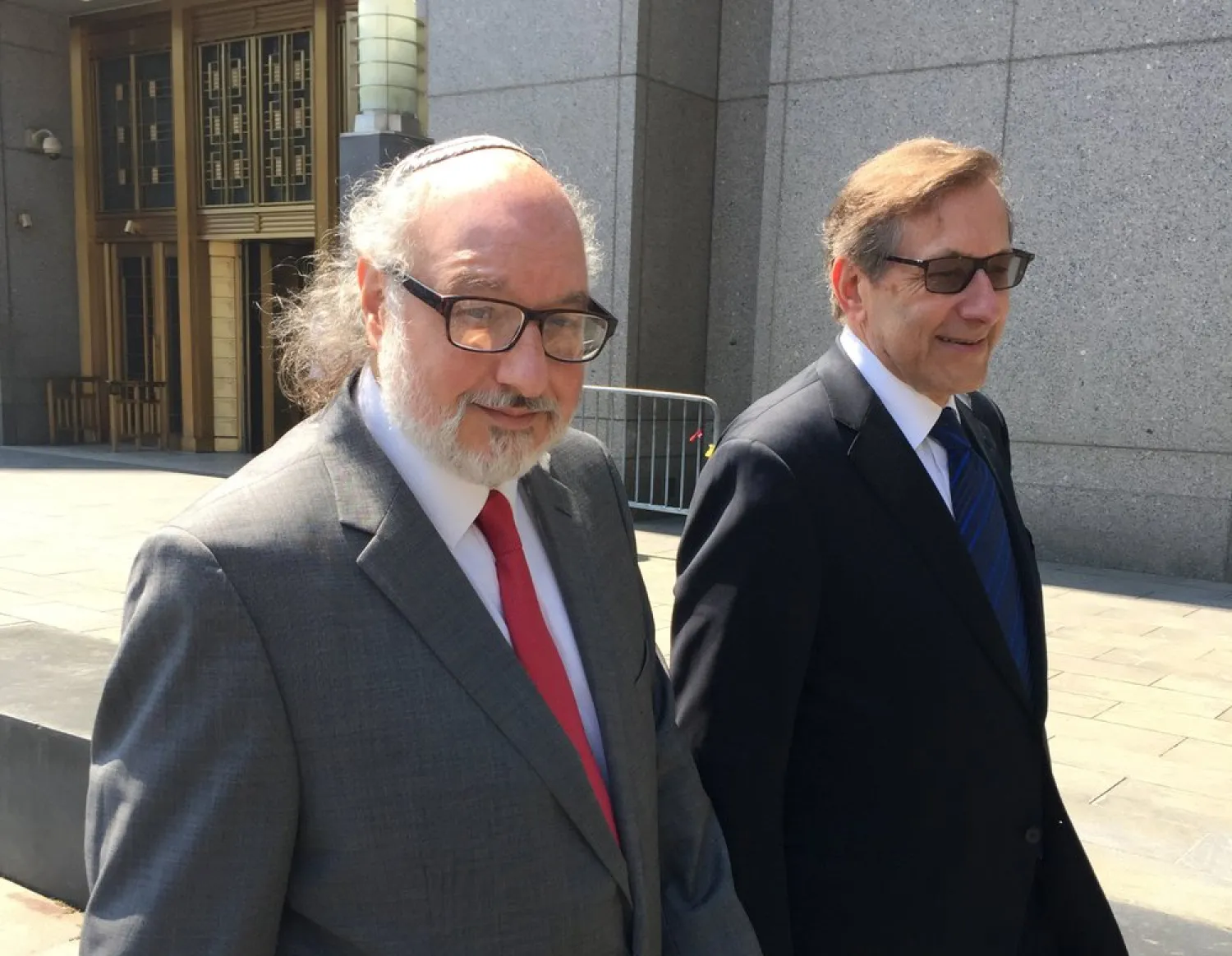 FILE - In this July 22, 2016, file photo convicted spy Jonathan Pollard, left, with his lawyer, Eliot Lauer, leaves federal court in New York following a hearing. Israeli media say Pollard, who spent 30 years in US prison for spying for Israel, has landed in the country with his wife.(AP Photo/Larry Neumeister, File)
