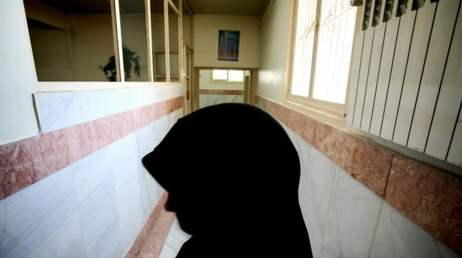 A female prison guard stands in a corridor in Tehran's Evin Prison in 2006. Morteza Nikoubaz/Reuters
