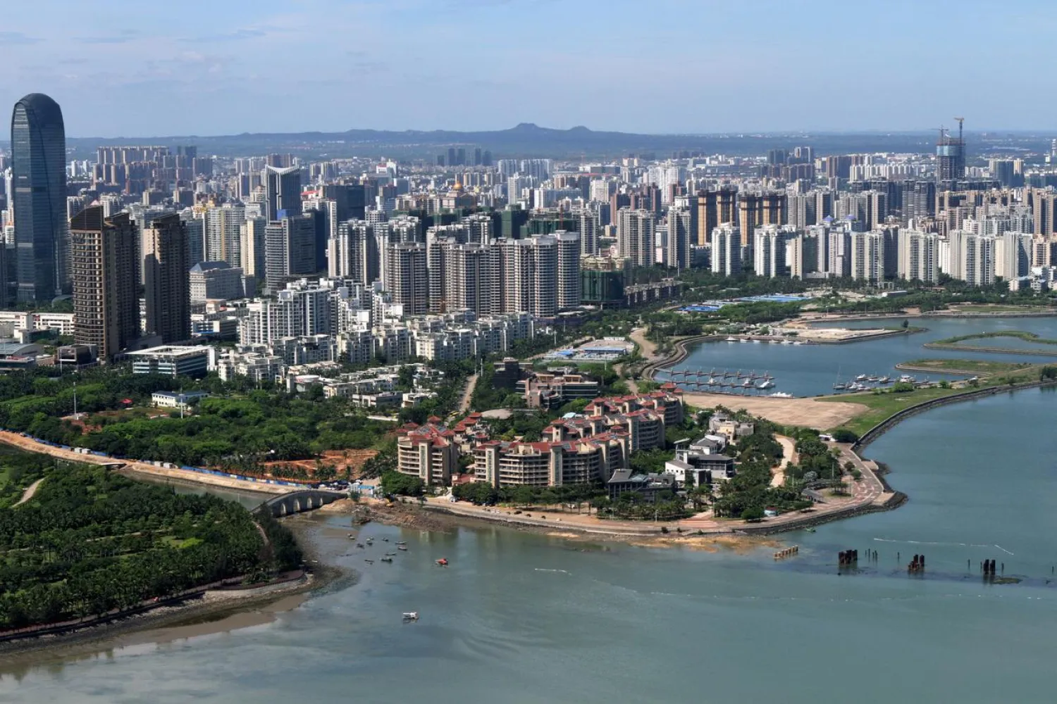 FILE PHOTO: The downtown area of Haikou city is pictured in Hainan province, China May 6, 2018. China Daily via REUTERS