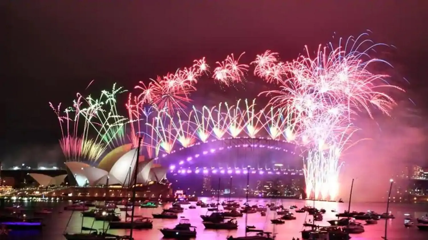 Fireworks explode over the Sydney Opera House and Sydney Harbor Bridge during downsized New Year's Eve celebrations during the COVID-19 pandemic, in Australia. (Reuters)