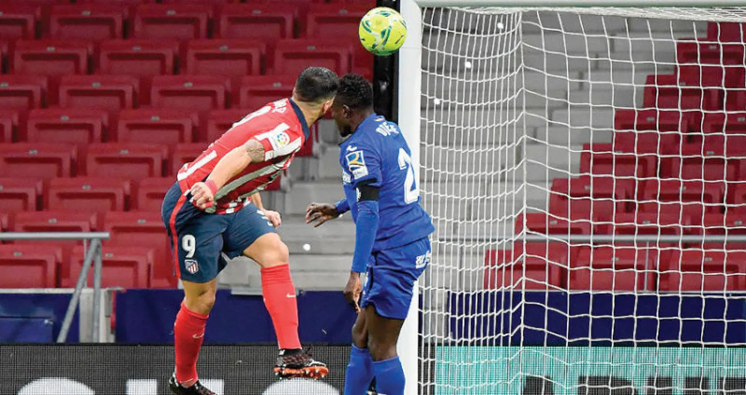 سواريز يسجل في مرمى خيتافي ليمنح أتلتيكو الفوز (أ.ف.ب)
