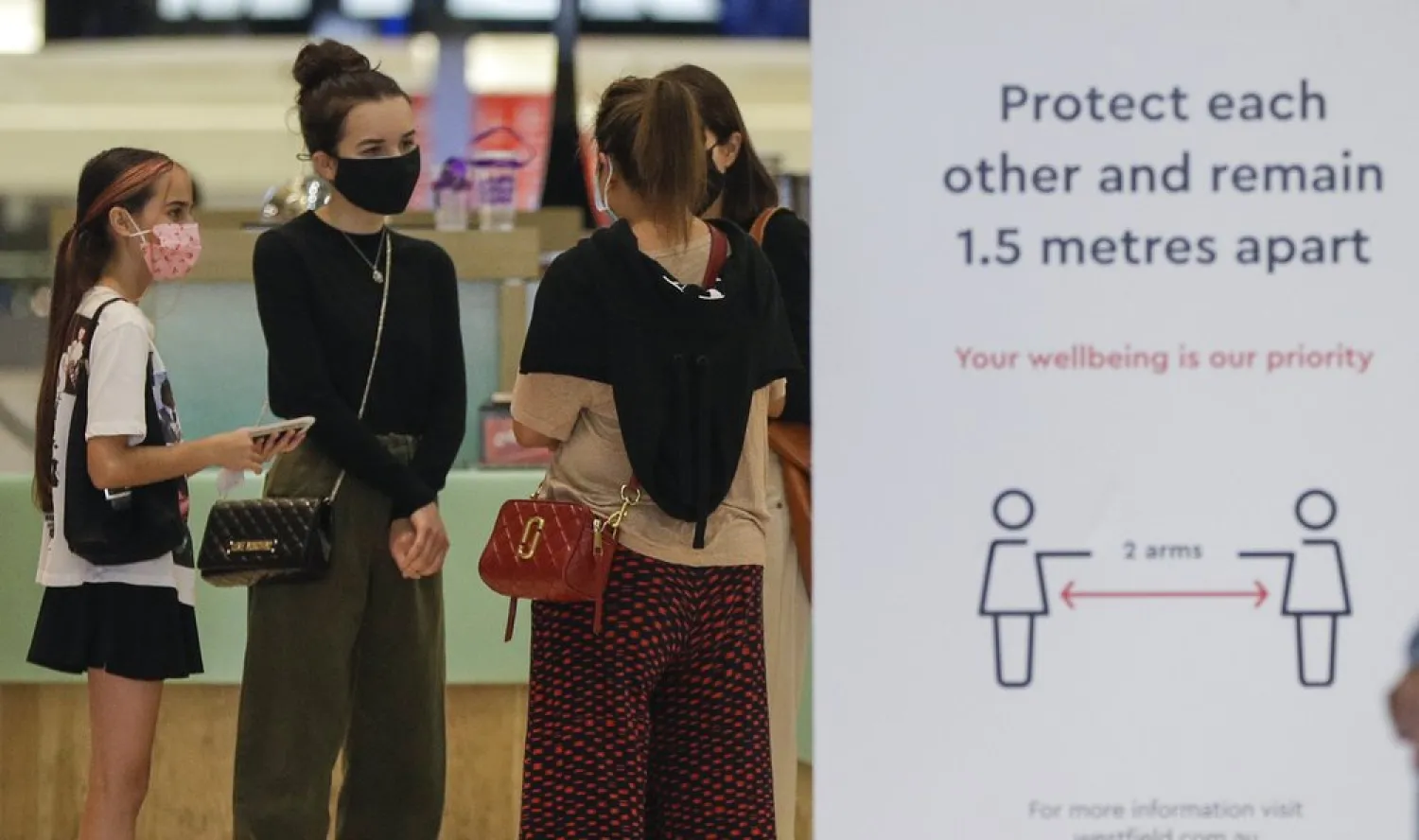 Shoppers wear masks as they walk around a shopping precinct in Sydney, Australia, Sunday, Jan. 3, 2021. AP