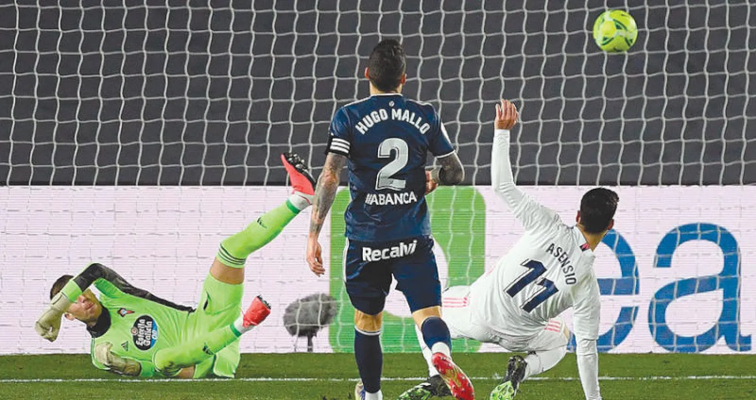 أسينسيو مهاجم الريال (رقم 11) يسجل في مرمى سلتا فيغو (أ.ف.ب)