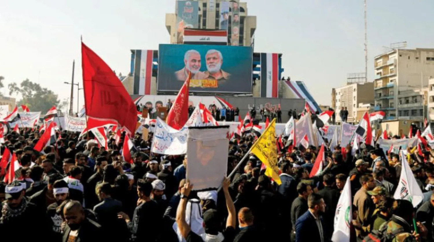 Supporters of the PMF and pro-Iran factions commemorate the killing of senior Iranian military commander General Qassem Soleimani and Iraqi militia commander Abu Mahdi al-Muhandis in a US attack, in Baghdad, Iraq, January 2, 2021. © REUTERS
