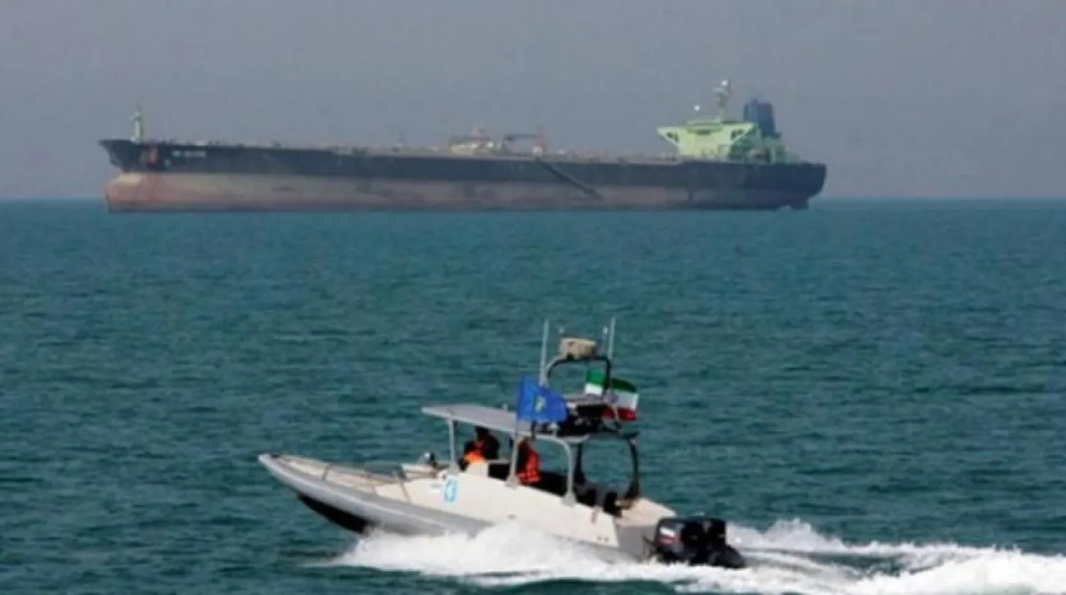 An Iranian Revolutionary Guards vessel approaches an oil tanker in the Strait of Hormuz. (AP file photo)