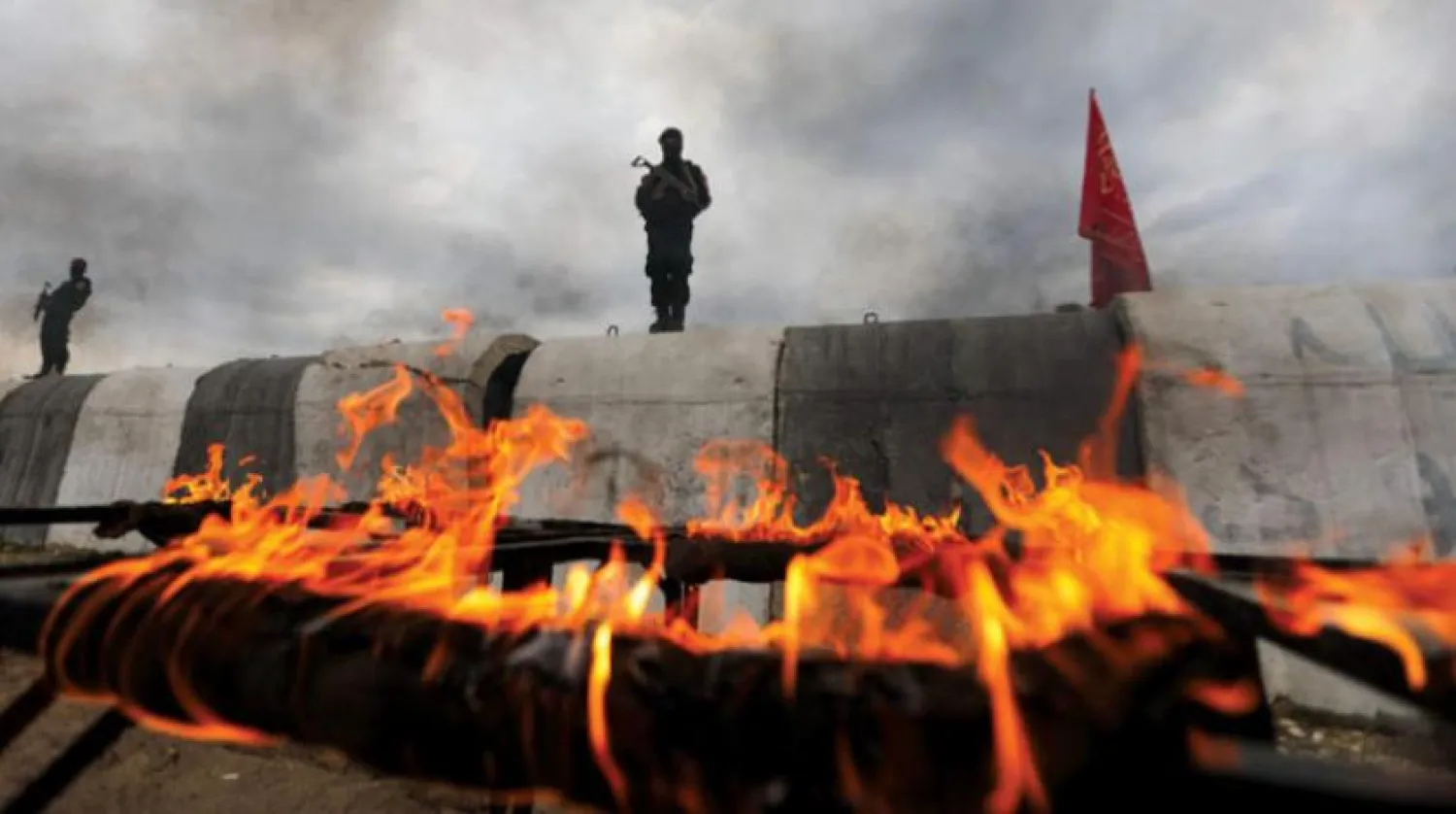 Geçtiğimiz cumartesi günü Halep kırsalında yer alan Afrin'deki bir üste yapılan askeri eğitim tatbikatı sırasında çekilen bir kare  (AFP)