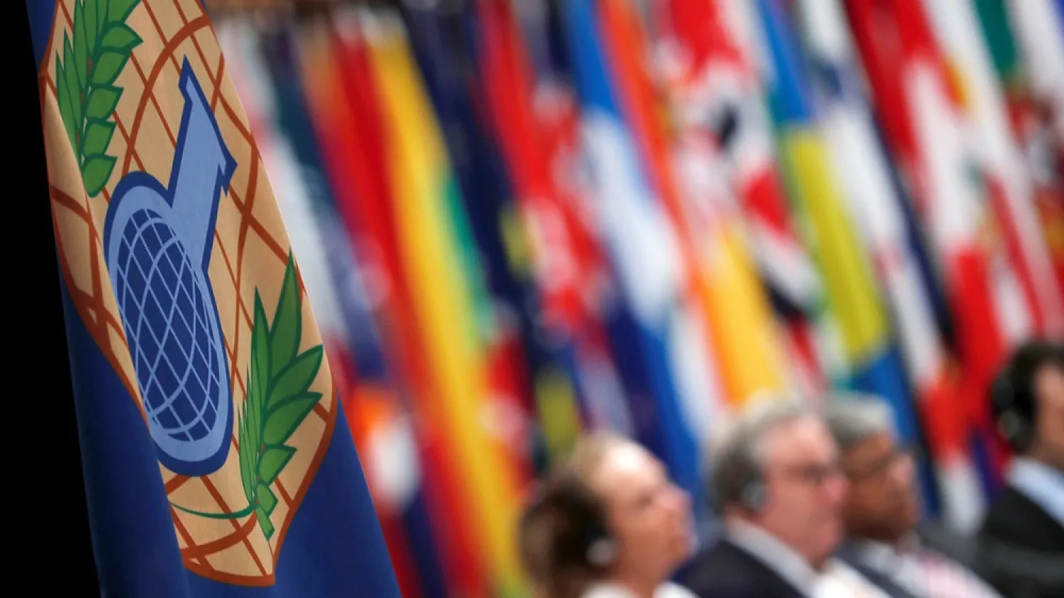 A flag with the logo of the OPCW is seen during a special session in the Hague. (Reuters)