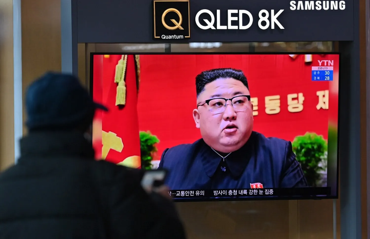 A man watches a television screen showing news footage of North Korean leader Kim Jong Un attending the 8th congress of the ruling Workers' Party held in Pyongyang, at a railway station in Seoul. (AFP)