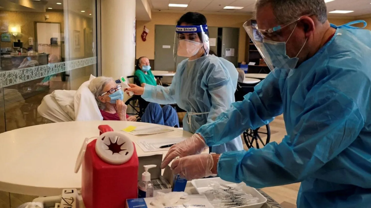 A resident of a nursing home in Brooklyn, New York, receives the Pfizer-BioNTech Covid-19 vaccine at a local pharmacy. (Reuters)