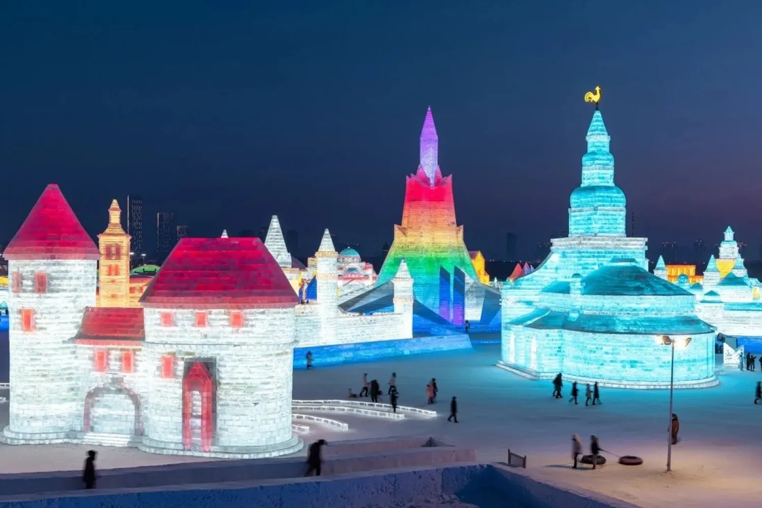 Visitors take in the ice sculptures at the Harbin Ice and Snow Festival in northeastern China's Heilongjiang province. (AFP)