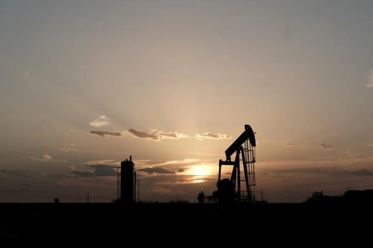 Oil pump jacks work at sunset near Midland, Texas, U.S., August 21, 2019. (Reuters)
