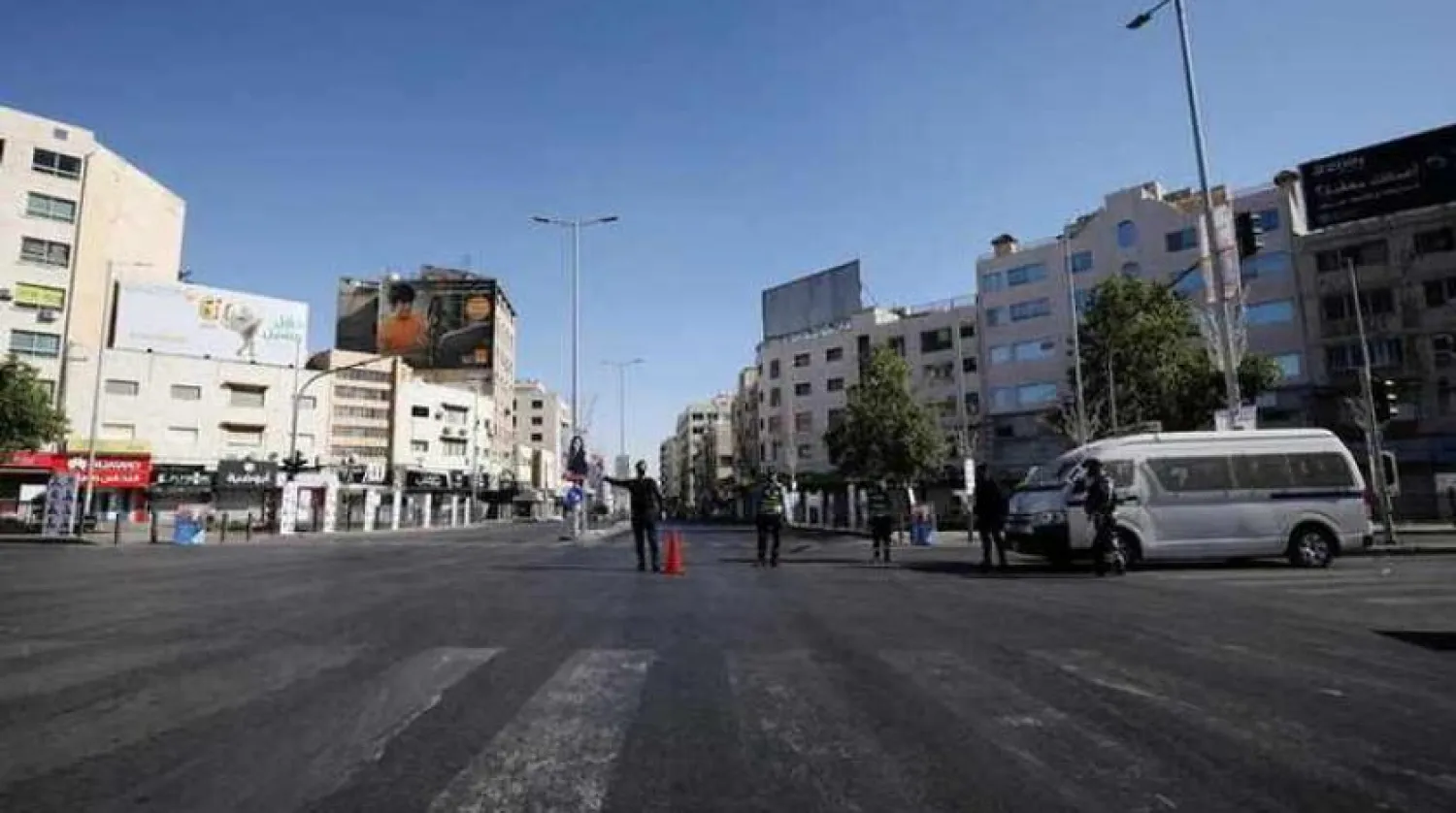 Jordanian police personnel guard at a checkpoint during the second day of a nationwide curfew, imposed for two days, amid fears of a rising number of coronavirus disease (COVID-19) cases in downtown Amman, Jordan October 17, 2020. Reuters/Muhammad Hamed
