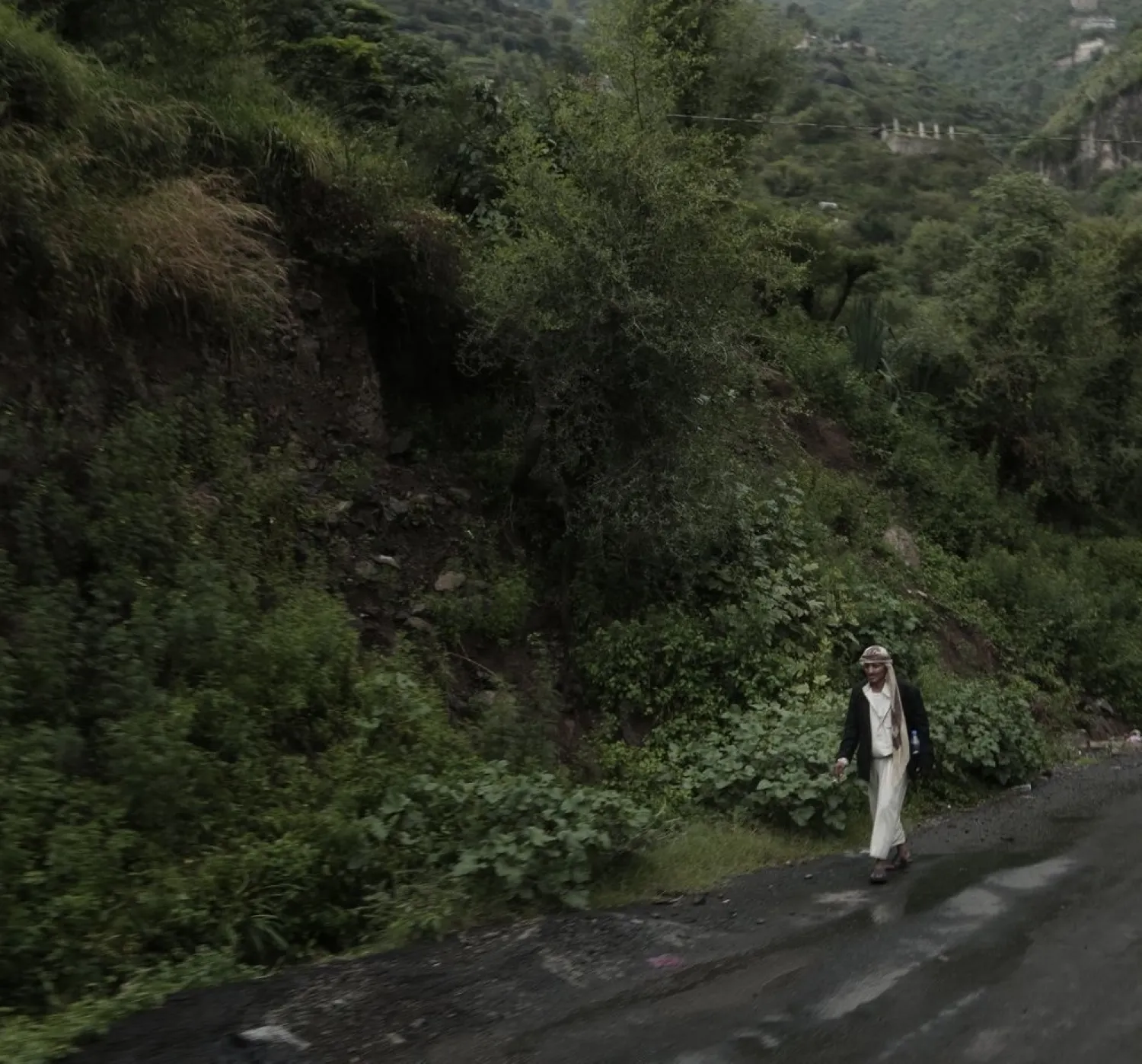 A man walks down a road in Ibb, Yemen, on Aug. 3, 2018. (AP)