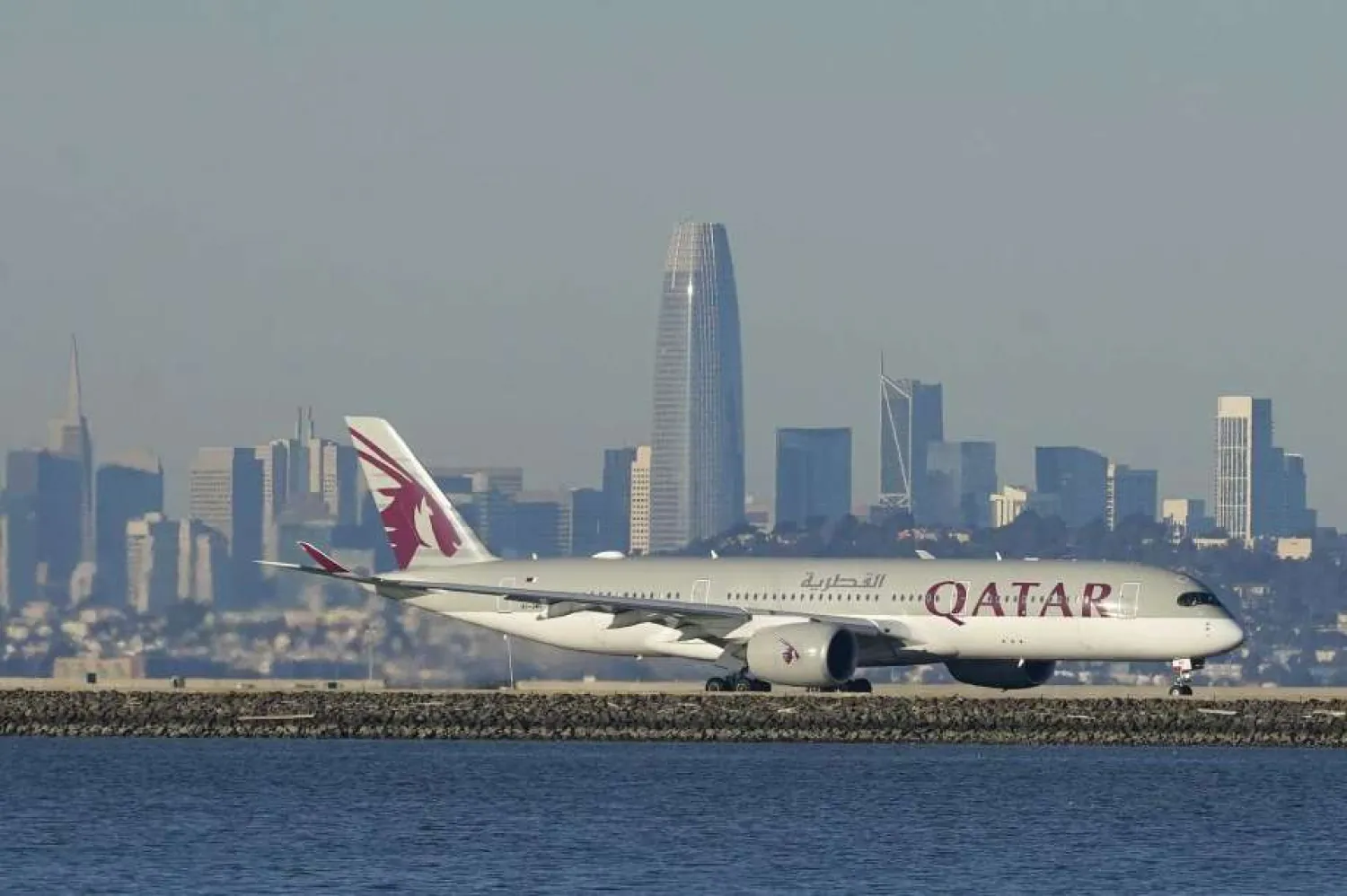 In this Dec. 22, 2020 file photo, a Qatar Airways plane prepares to take off at San Francisco International Airport during the coronavirus pandemic in San Francisco. (AP Photo/Jeff Chiu, File)