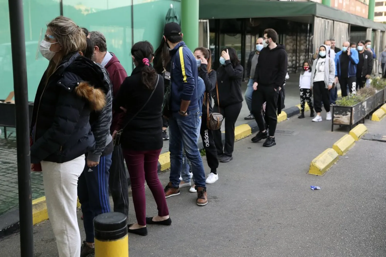 People line up to enter a supermarket, in Beirut, Lebanon, Monday, Jan. 11, 2021. (AP)