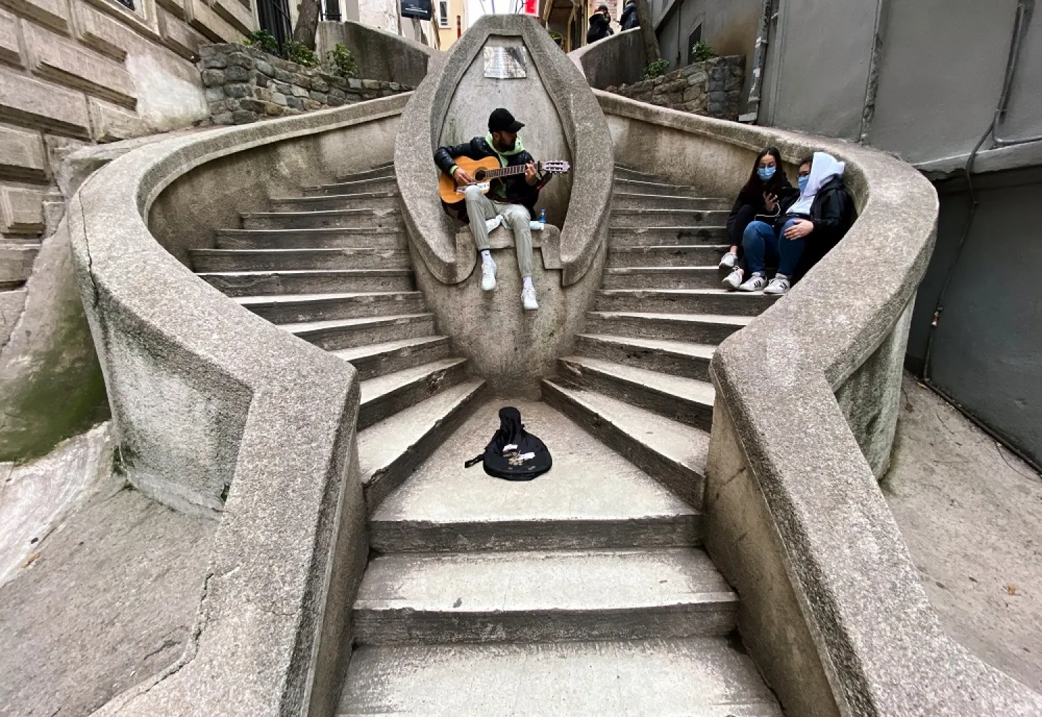 A musician performs at the Camondo Stairs amid the spread of the coronavirus disease (COVID-19), in Istanbul, Turkey on Jan. 12, 2021. (Reuters)