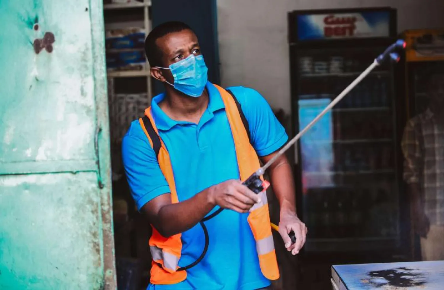 A Sudanese sprays disinfectant amid fears of the spread of the coronavirus disease in Khartoum. (dpa)
