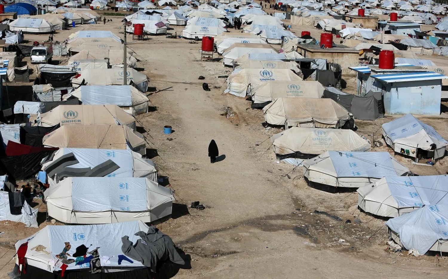A woman walks through al-Hol displacement camp in Syria April 2, 2019. (Reuters)