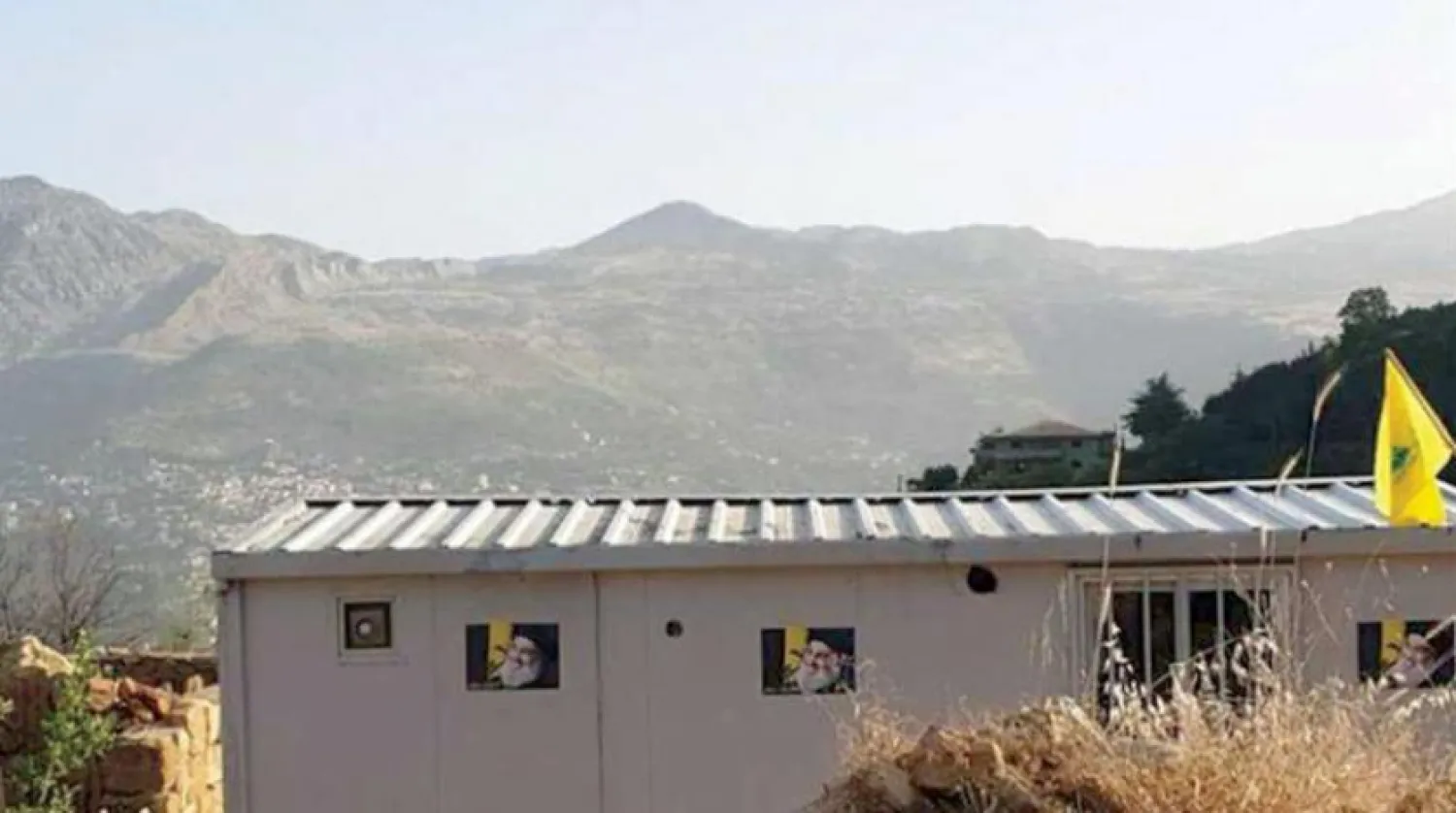 A container housing unit displaying the flag of the Hezbollah group in the Byblos District (Asharq Al-Awsat)

