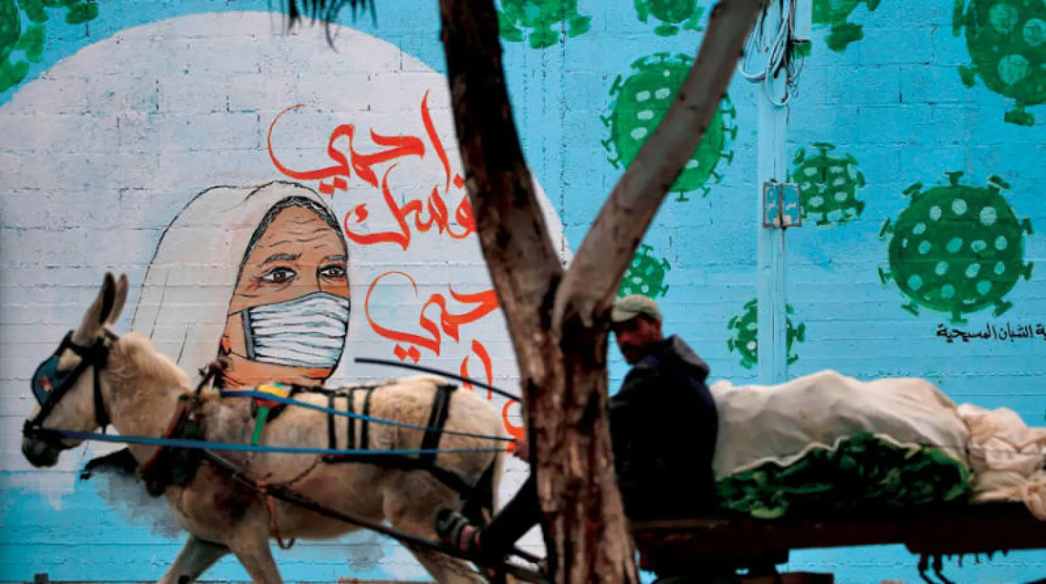 تواجه غزة حصارين أحدهما وباء كورونا (أ.ف.ب)