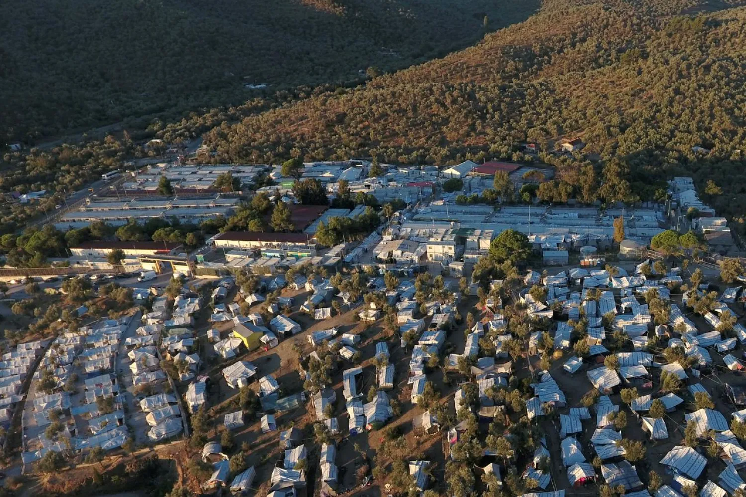 FILE PHOTO: A view of the Moria camp for refugees and migrants and part of a makeshift camp set next to Moria, on the island of Lesbos, Greece, September 19, 2018. REUTERS/Giorgos Moutafis/File Photo