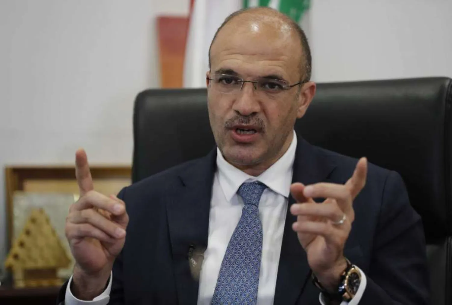 FILE - In this July 20, 2020 Lebanese Minister of Health Hamad Hassan, gives an interview to The Associated Press, in Beirut, Lebanon. AP