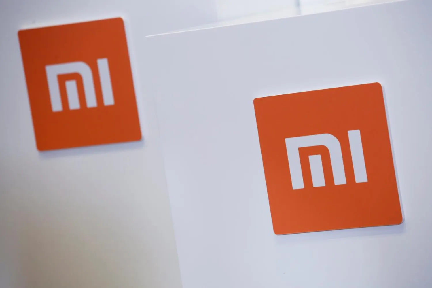 Xiaomi logos are seen during a news conference in Hong Kong, China June 23, 2018. REUTERS/Bobby Yip/File Photo