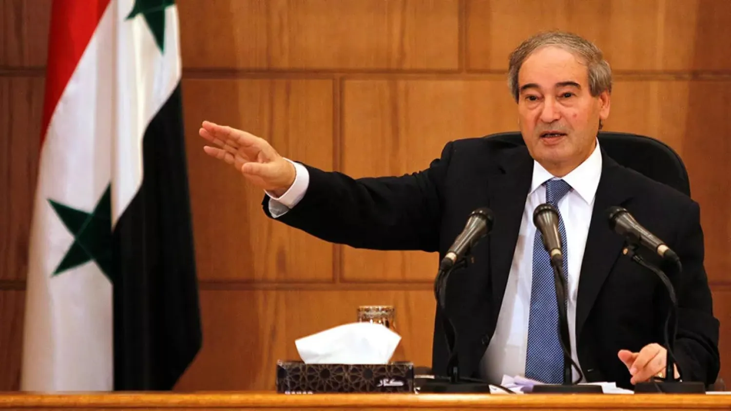 Mekdad gestures during a news conference in Damascus, Syria. (Reuters file photo)