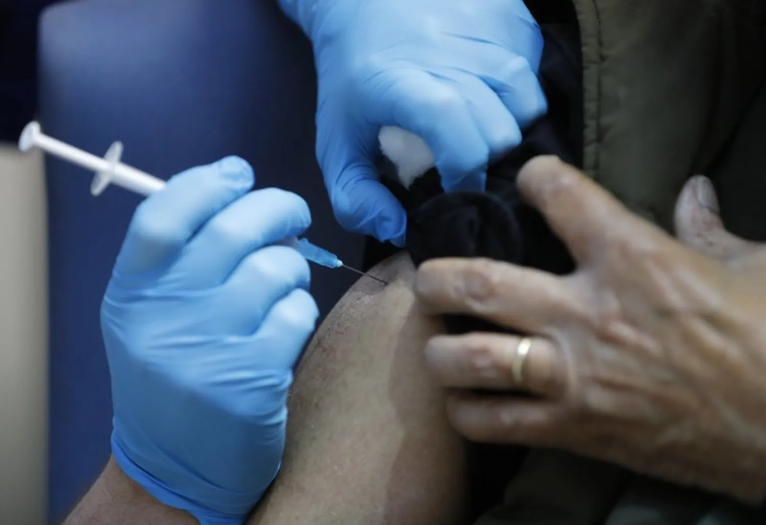 A nurse administers the Pfizer-BioNTech vaccine at a hospital in London, UK. AP file photo
