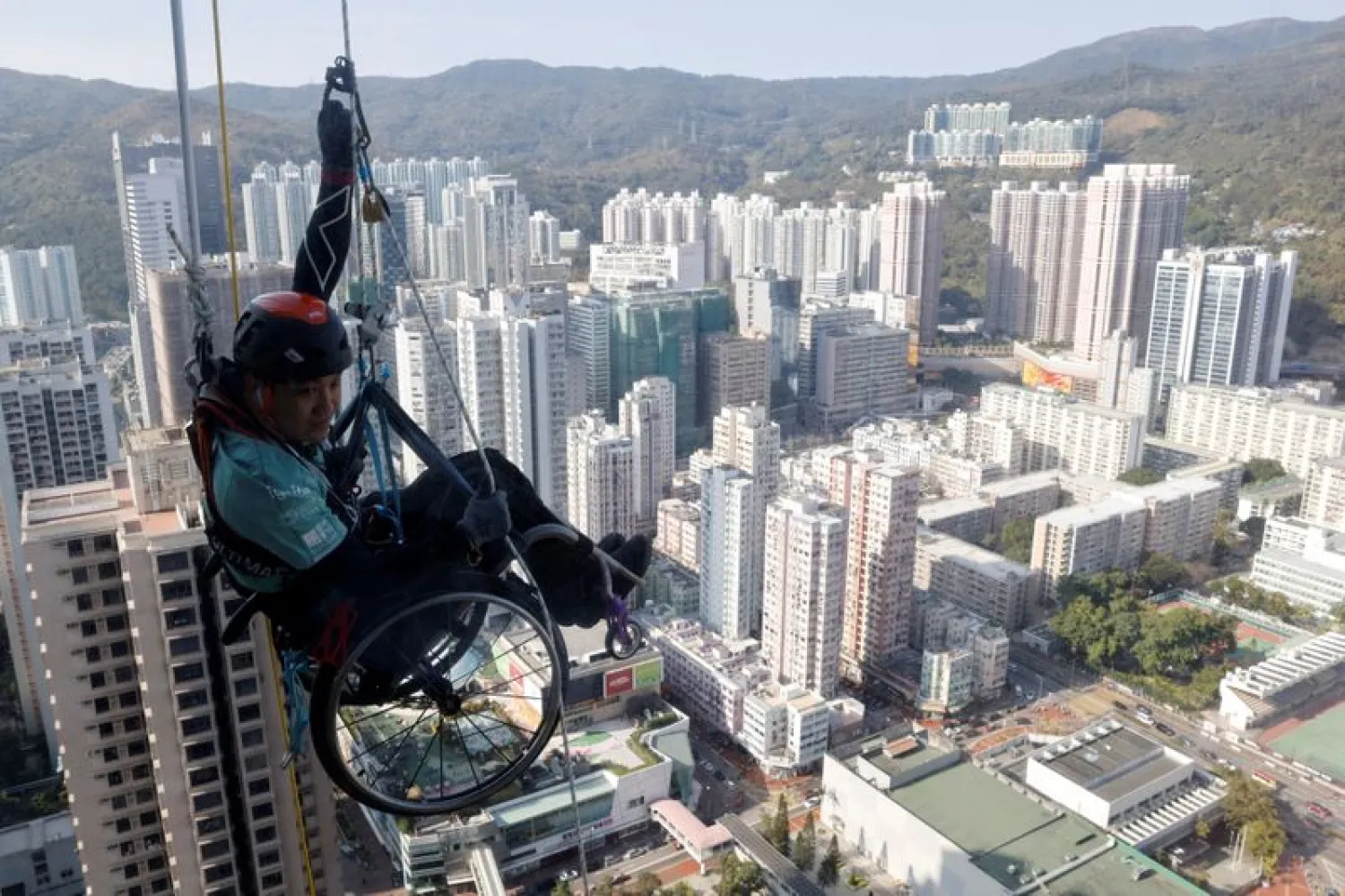 In Wheelchair, Paraplegic Lai Chi-Wai Climbs up Skyscraper in Hong Kong