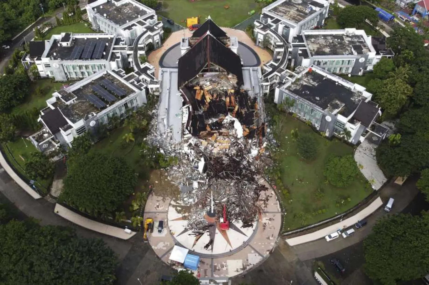 A government building is seen badly damaged following an earthquake in this aerial photo taken using a drone in Mamuju, West Sulawesi, Indonesia, Saturday, Jan. 16, 2021. (AP Photo/Abdi Latief)