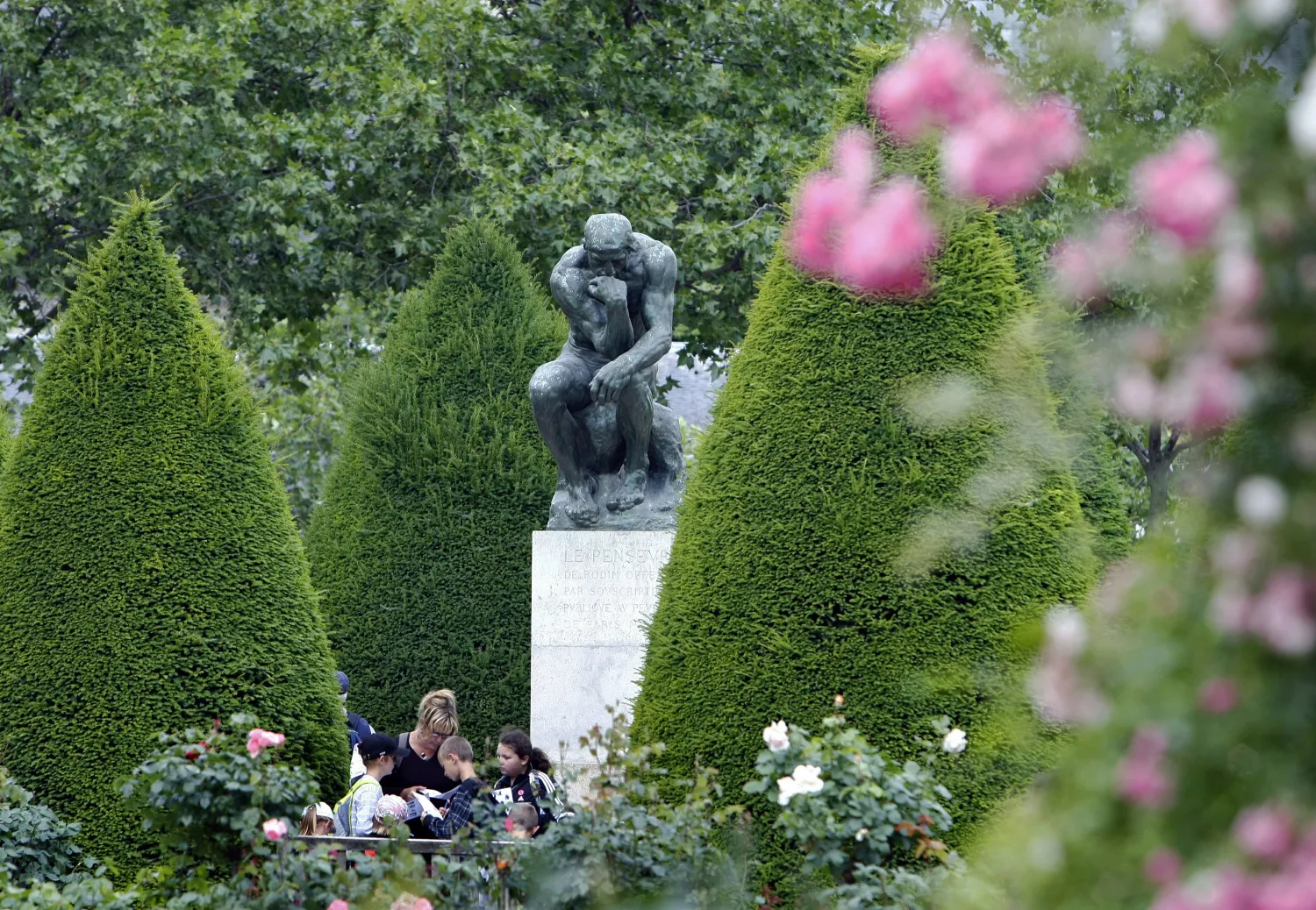 FILE - In this Tuesday, May 31, 2011 file photo, people stand in the garden of the Rodin museum in Paris. (AP Photo/Remy de la Mauviniere, File)