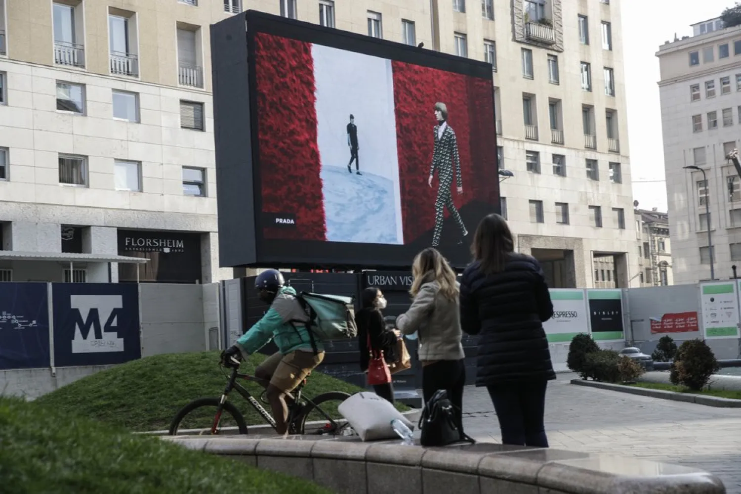 A giant screen streams a Prada fashion live show during the Milan's fashion week in Milan, Italy, Sunday, Jan. 17, 2021. (AP)