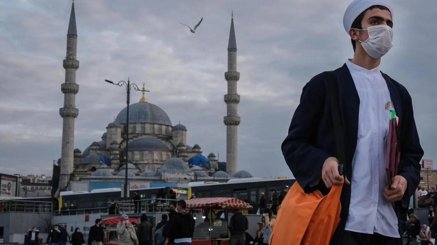 A man wearing face mask walks in front of the Yeni Mosque at the Eminonu Square in Istanbul, Turkey, January 8. (EPA)
