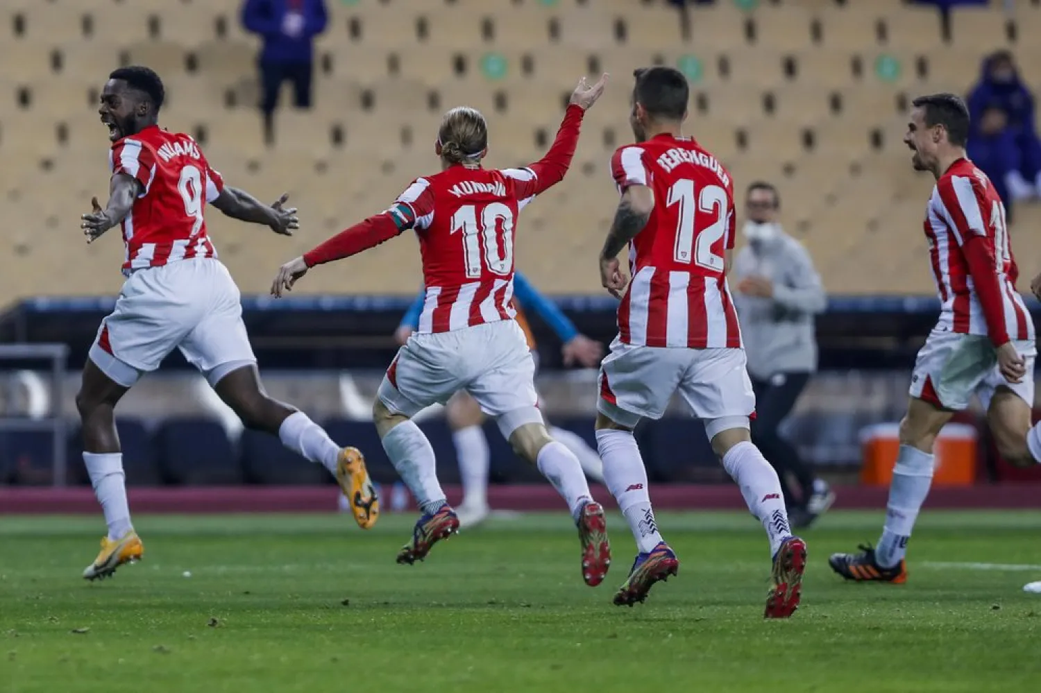 Athletic Bilbao's Inaki Williams, left, celebrates after scoring his team third goal during the Spanish Supercopa final against Barcelona at La Cartuja stadium in Seville, Spain, Jan. 17, 2021. (AP)