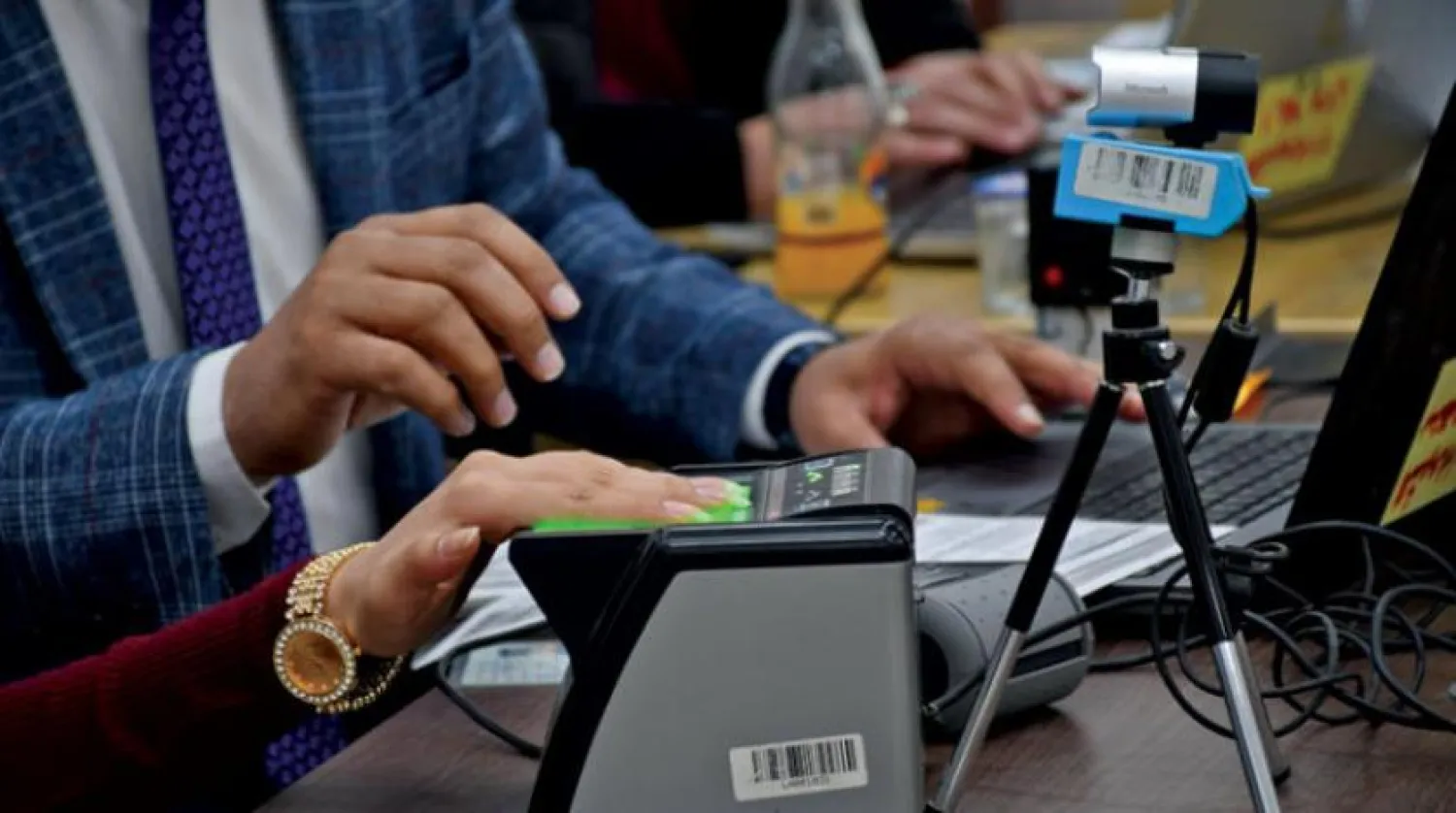 A female voter updates her data at the Independent High Electoral Commission Center in Nasiriyah (AFP) 