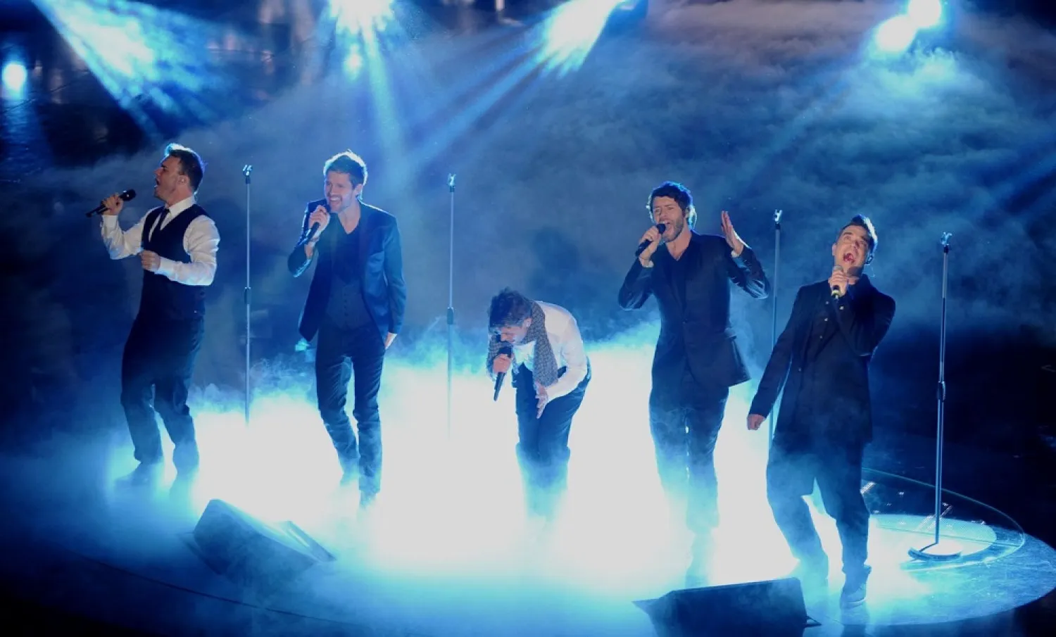 (L-R) Gary Barlow, Howard Donald, Jason Orange, Mark Owen and Robbie Williams of the band 'Take That' perform during the 61st Italian Music Festival on February 18, 2011. (Getty Images)