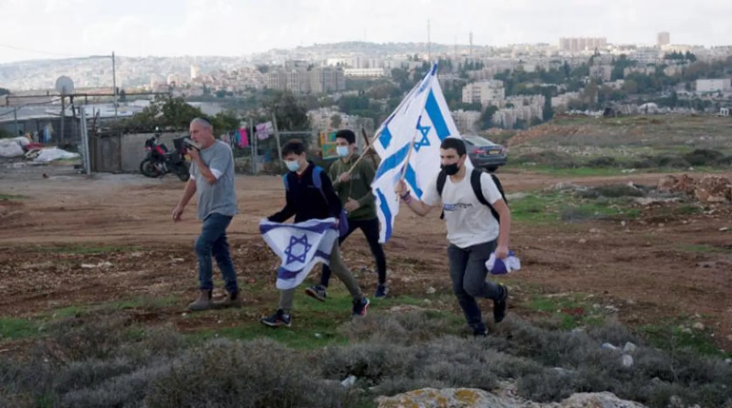 Yerleşimciler, Kasım ayında Avrupa Birliği heyetinin Doğu Kudüs’te yer alan ‘Givat Hamatos’ yerleşim alanına yaptığı ziyarete karşı çıktılar (AP)