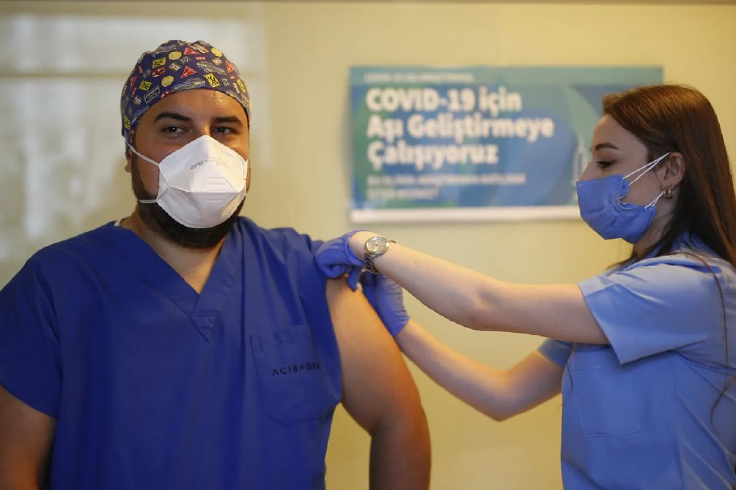FILE - In this Oct. 9, 2020 file photo, a health worker administers the first dose of a COVID-19 vaccine currently on phase III clinical trials to Cem Gun, an Emergency Medicine Physician, at the Acibadem Hospital in Istanbul, Friday, Oct. 9, 2020. (AP Photo/Emrah Gurel, file)
