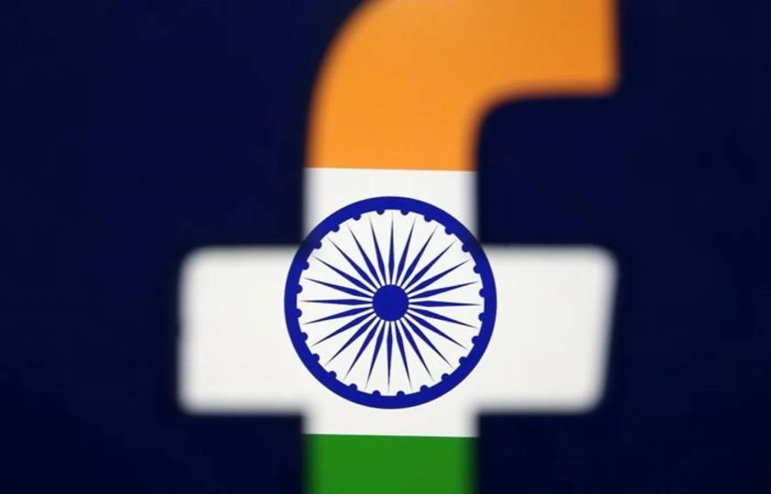 FILE PHOTO: India's flag is seen through a 3D printed Facebook logo in this illustration picture, April 8, 2019. REUTERS/Dado Ruvic/Illustration/File photo